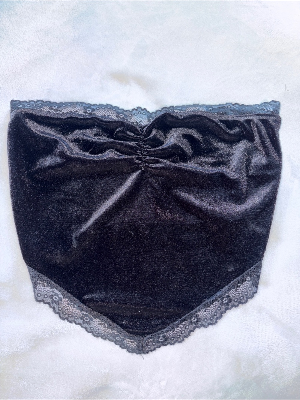 sleeveless black top with lace trim